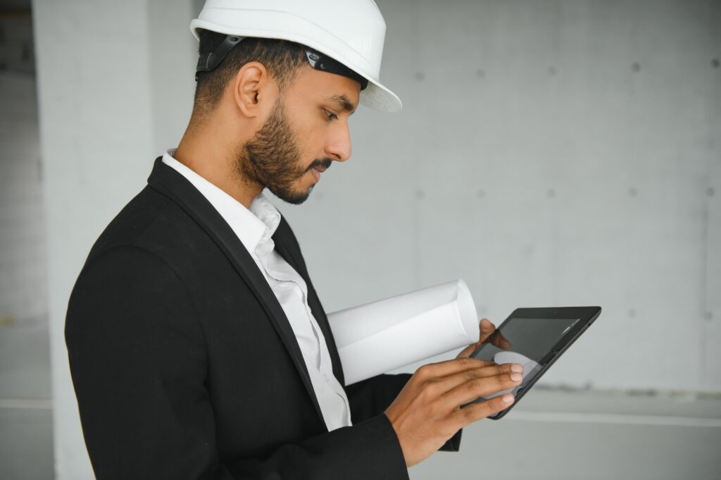 Confident asian engineer man Using tablet for checking and maintenance to inspection at modern home